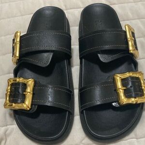 Schultz sandals.  Leather gold buckle straps